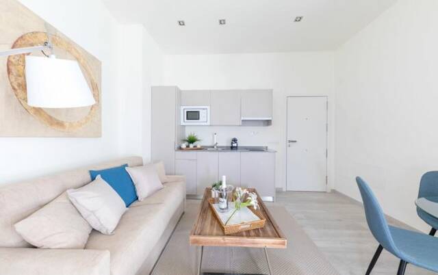Zithoek en keuken van appartementen Soho Boutique Museo in Malaga