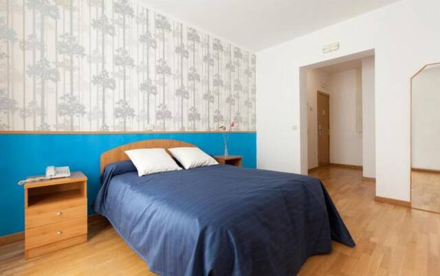 Slaapkamer van hostal Montaloya in Madrid
