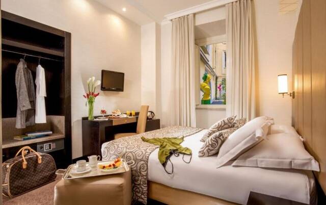 Slaapkamer van hotel Savoy in Rome