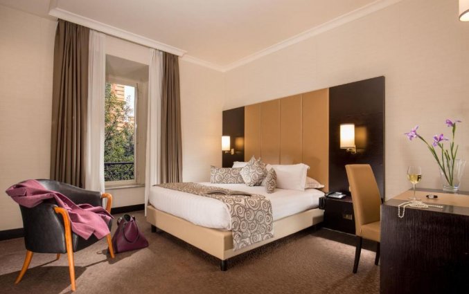 Slaapkamer van hotel Savoy in Rome