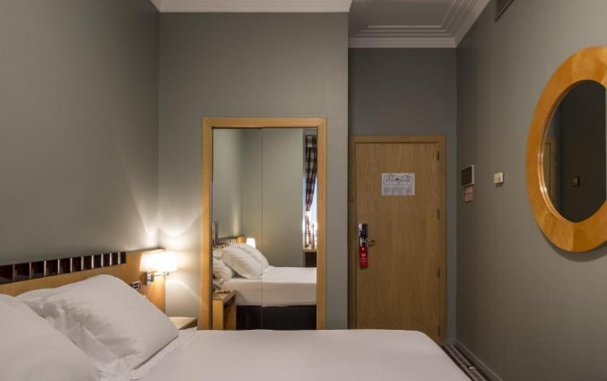 Slaapkamer van hotel Room Mate Larios in Malaga