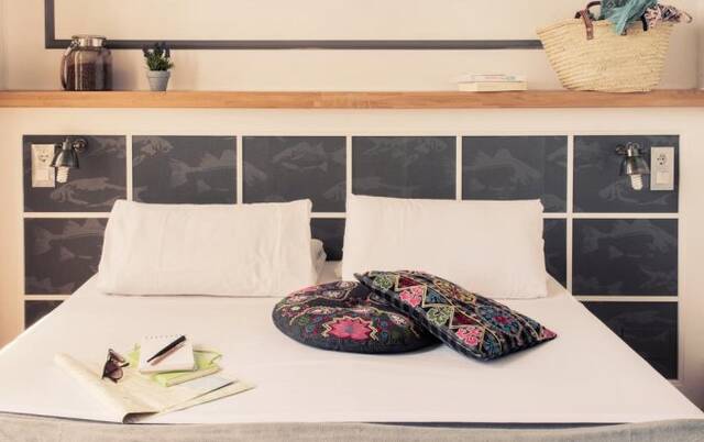 Slaapkamer van hotel Casa Gracia in Barcelona