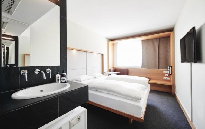 Slaapkamer van hotel Daniel Graz in Graz