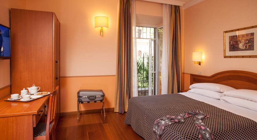 Slaapkamer van hotel Piemonte in Rome