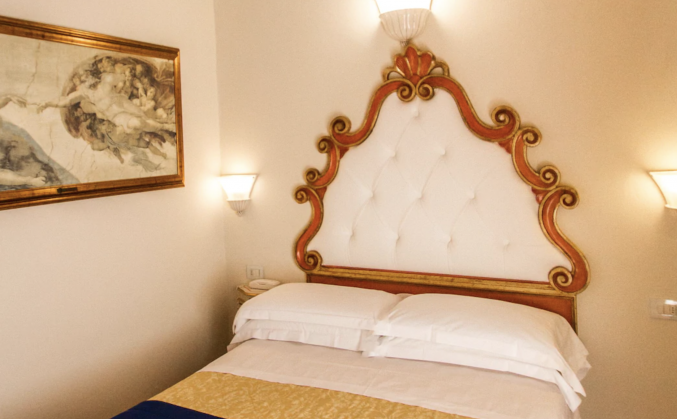 Slaapkamer in Hotel Porta Faenza