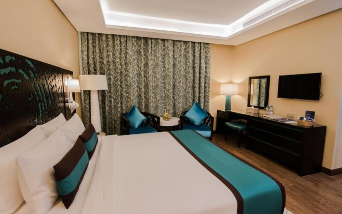 Slaapkamer in Hotel Signature Al Barsha