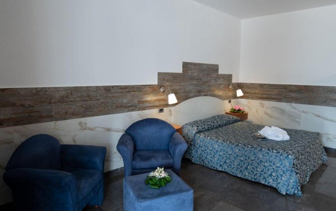 Kamer met zithoek van Hotel San Luca