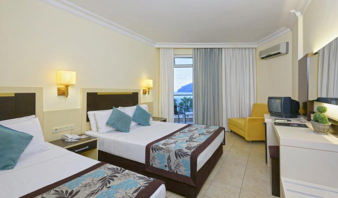 Slaapkamer van Hotel Monart City in Alanya