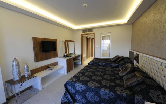 Slaapkamer van Hotel Diamond Hill Resort in Alanya