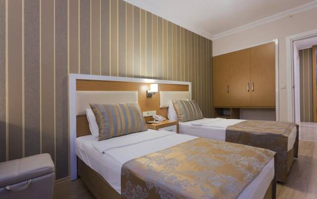 Slaapkamer van Hotel Lonicera City in Alanya
