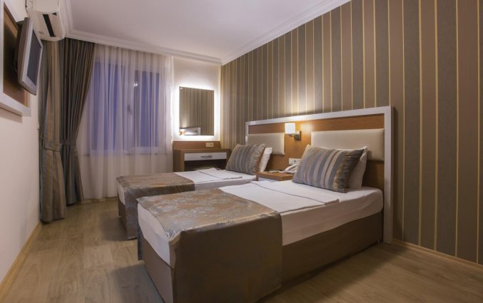 Slaapkamer van Hotel Lonicera City in Alanya