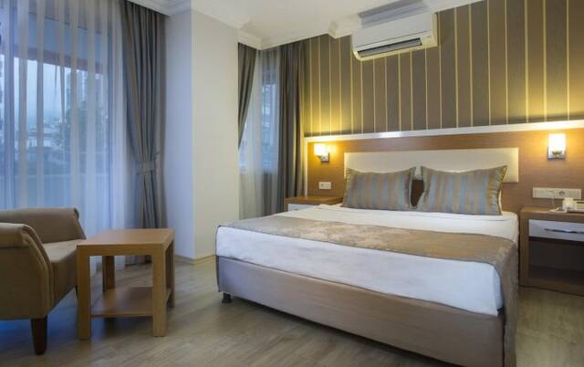 Slaapkamer van Hotel Lonicera City in Alanya