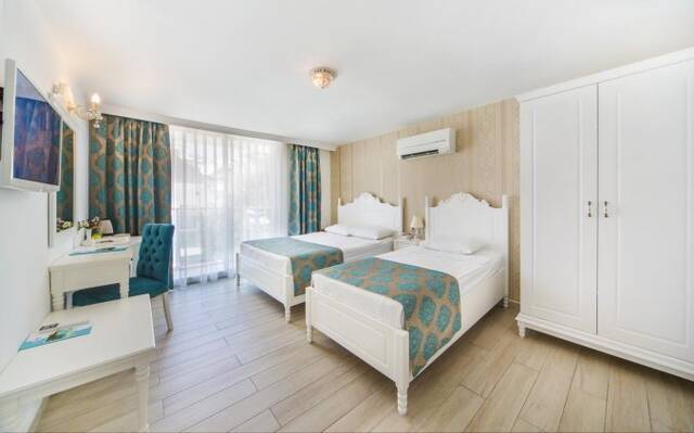 Slaapkamer van Hotel Kleopatra Atlas in Alanya