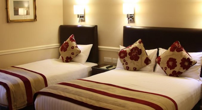 Slaapkamer van standaardkamer van hotel Harcourt in Dublin
