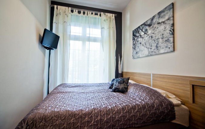 Slaapkamer van een appartement van Appartementen 4Seasons in Krakau