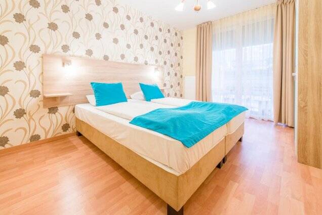 Tweepersoonsbed in appartement van nova apartments stedentrip Budapest