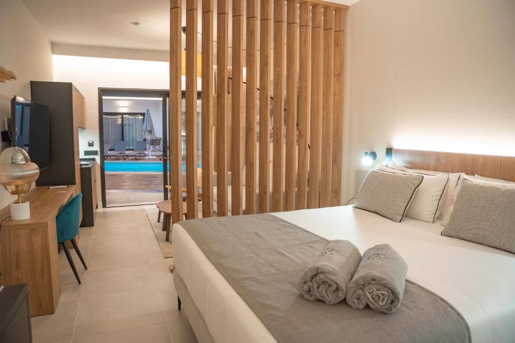 Saladar Suites Boutique - slaapkamer met scheidingswand
