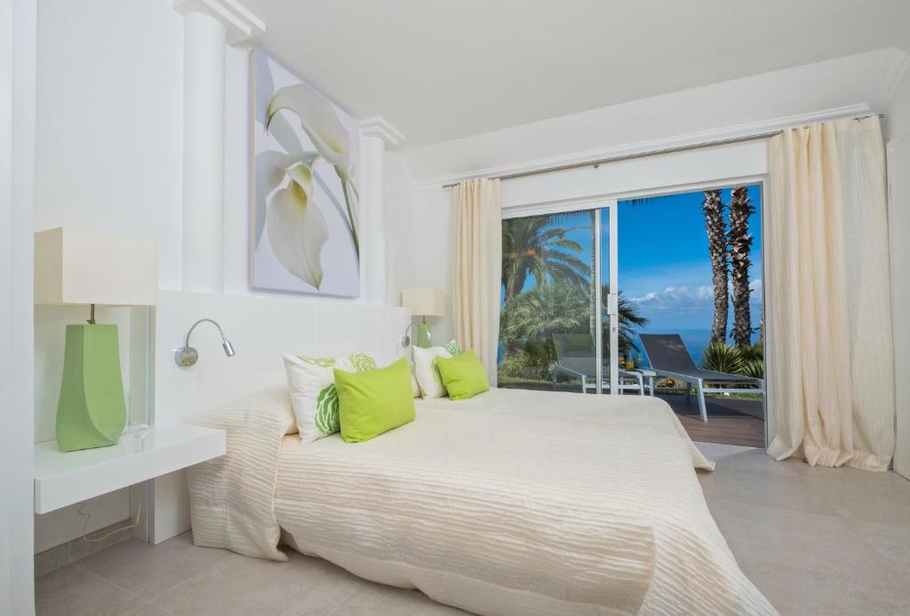 Hotel Jardin de la Paz - slaapkamer met terrasdeur