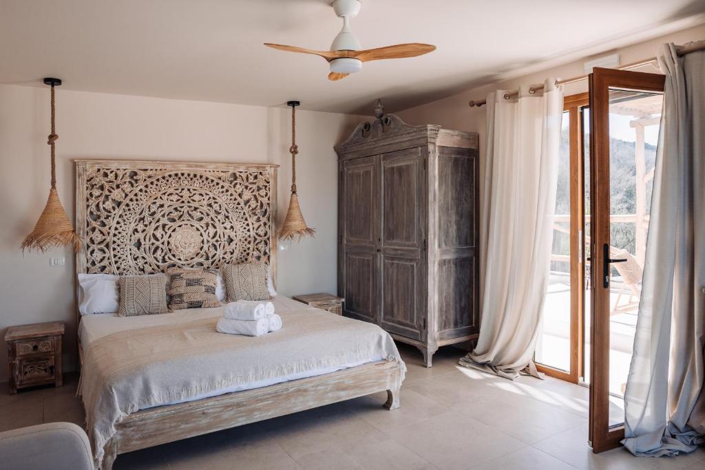 Boutique Eco Hotel Costa Magica - slaapkamer met terrasdeur