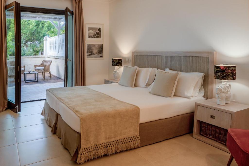 Canne Bianche Lifestyle Hotel - kamer met terras naar de tuin