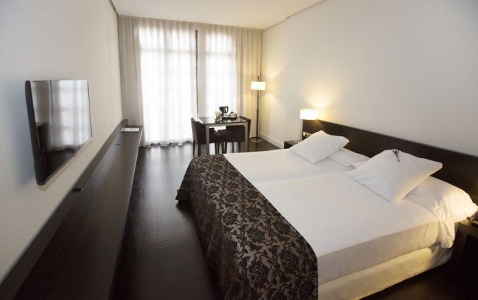 Slaapkamer van hotel Hospes Palau de La Mar in Valencia