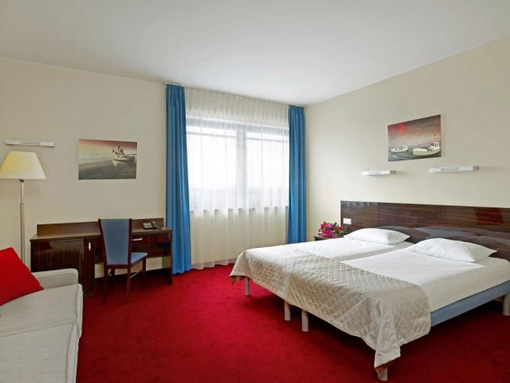 Tweepersoonsbed in kamer van Hotel Focus in Gdansk