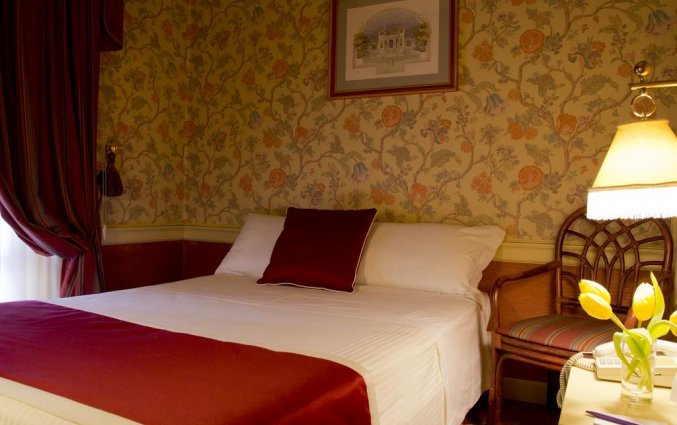 Bed op een kamer van Hotel iH Milano Regency Milaan Italië