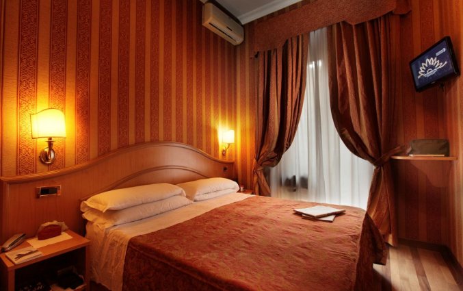 Slaapkamer van hotel Solis in Rome